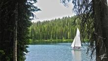 A sailboat maneuvers across the waters of Lake of the Woods