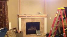 Working on the mantle uprights, note the plug in the ceiling at the top